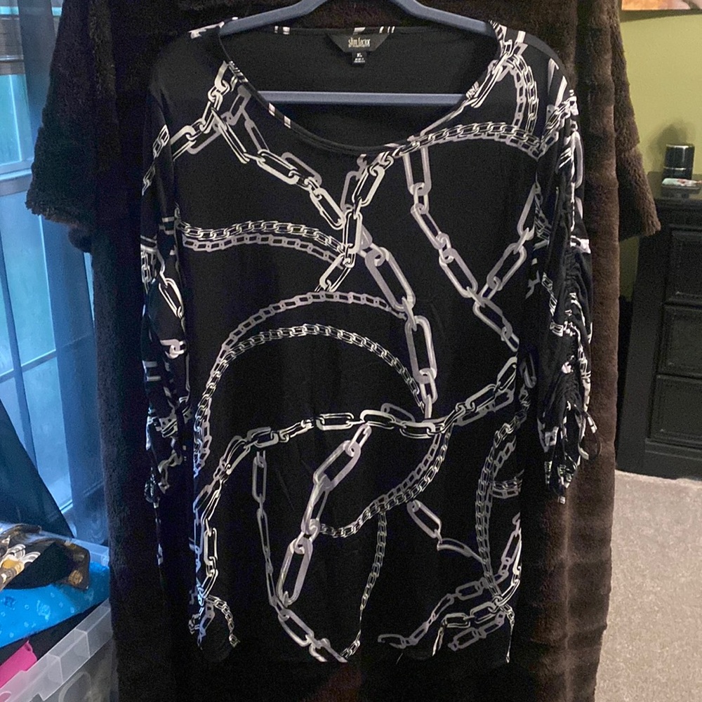 Black and white Tunic. Looks great with black leggings. Very slimming.